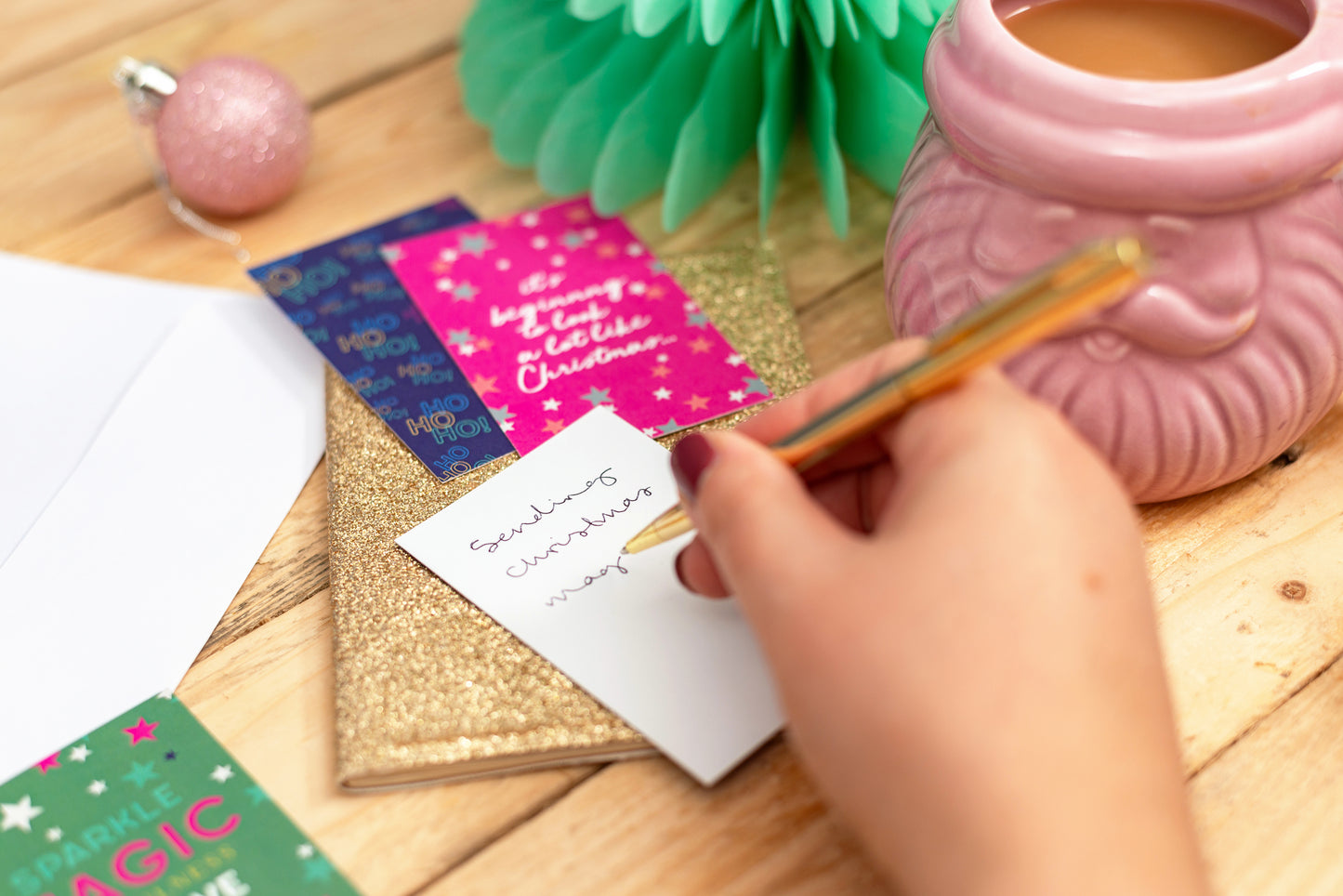 Close-up of a Christmas-themed inspirational quote card with holiday graphics.