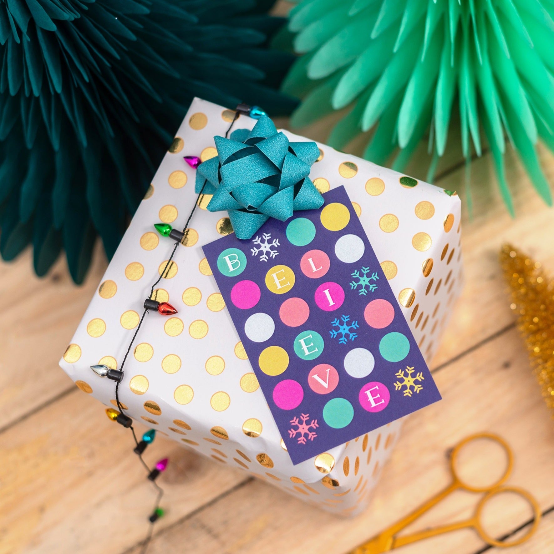 Close-up of a Christmas-themed inspirational quote card with holiday graphics.