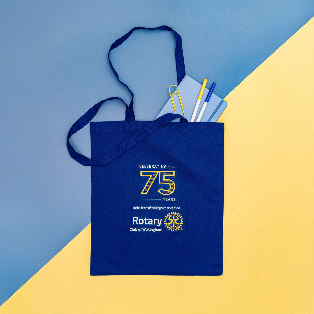 Blue tote bag with 'Rotary Club of Wokingham' branding on a blue and yellow background