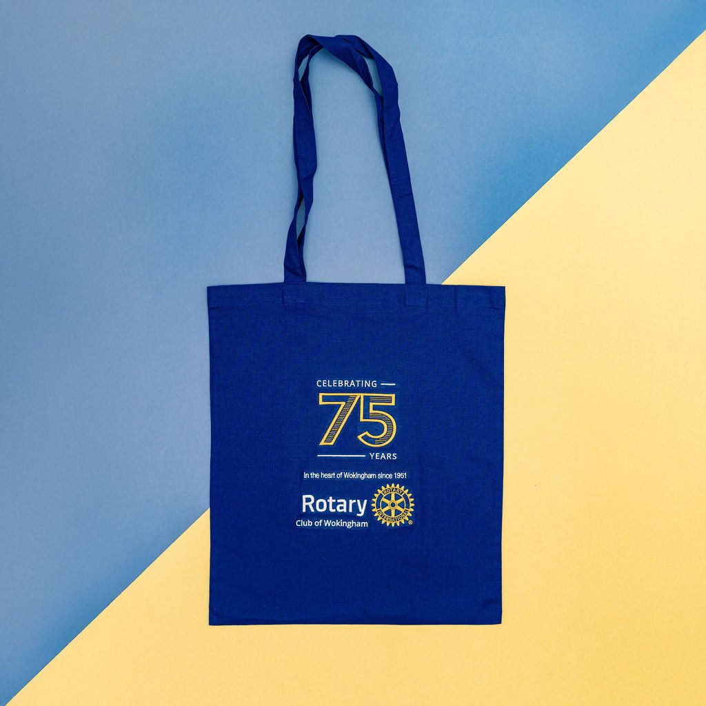 Blue tote bag with Rotary Club of Wokingham branding on a blue and yellow background