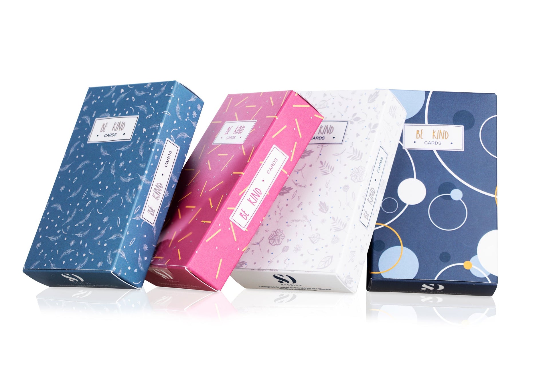 Four colorful boxes with geometric patterns on a white background